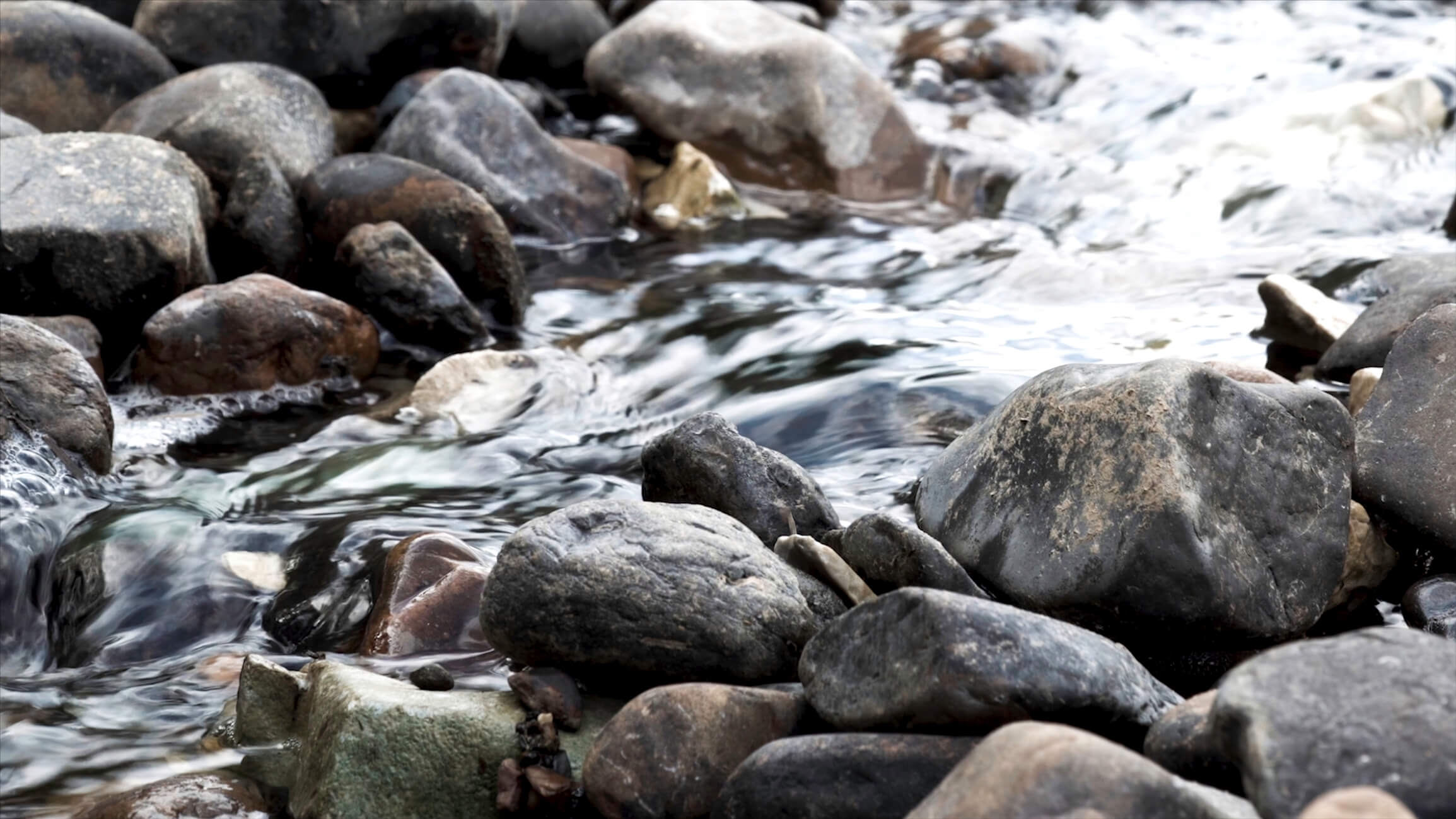 River-Water-Running-Over-Rocks-iStock-1437976264.jpg