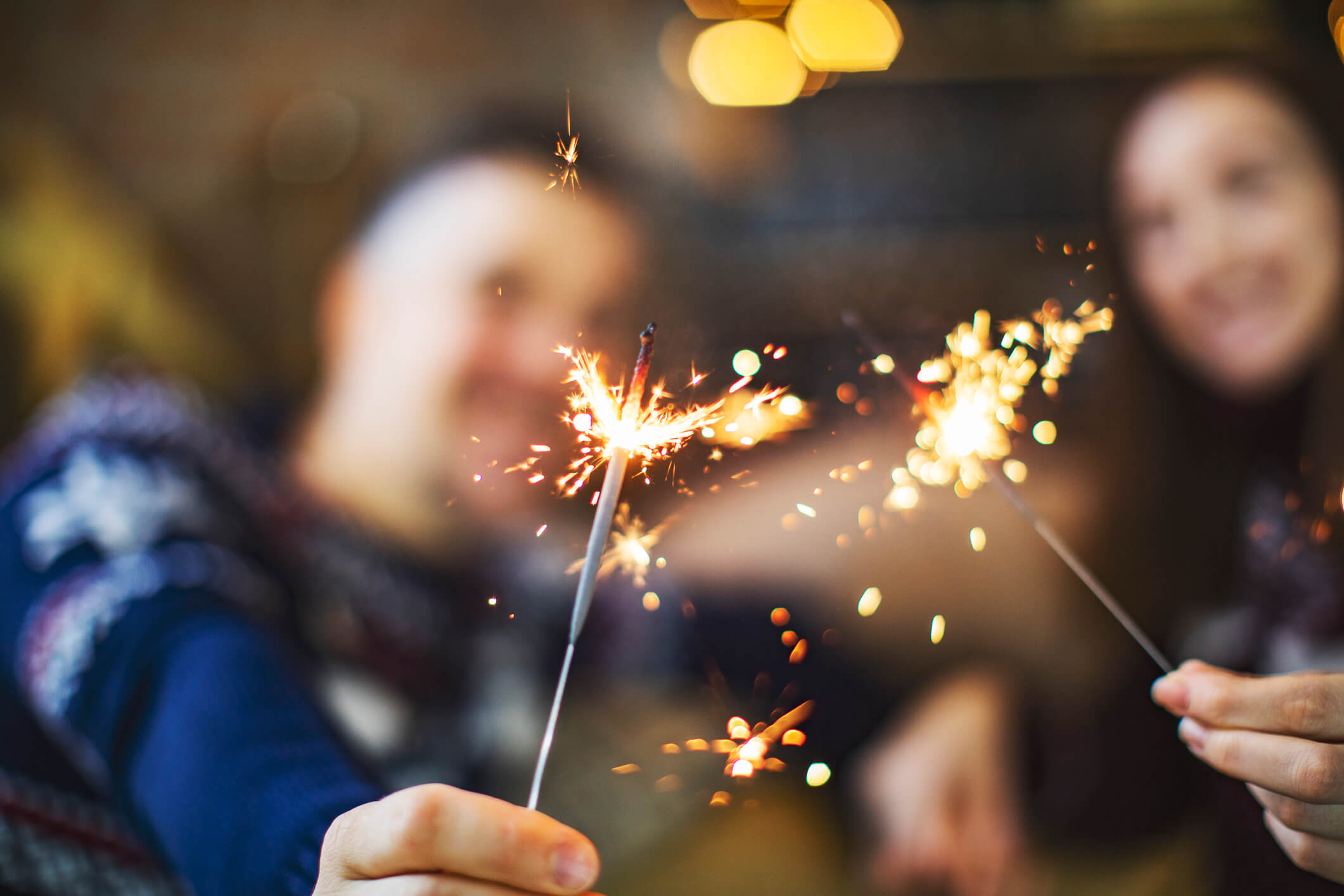 Sparklers-in-Hands-Wearing-Sweaters-iStock-1169805004.jpg